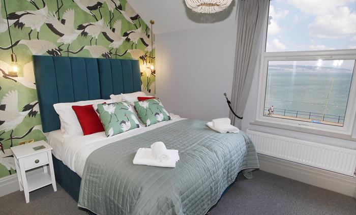 situated on the second floor with sea views. King size bed. TV and dressing table